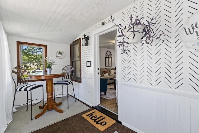 dining room with vaulted ceiling