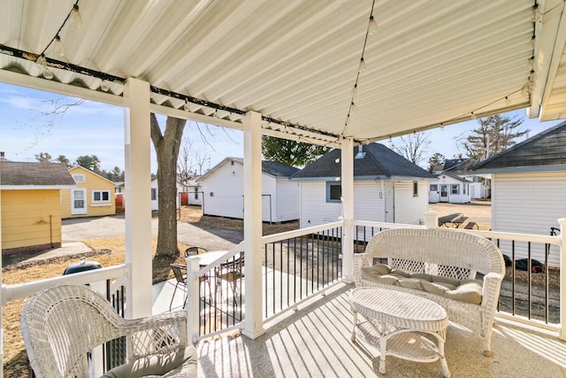 deck featuring an outbuilding and a residential view