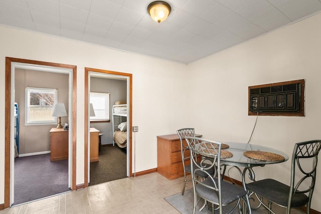 dining area featuring baseboards