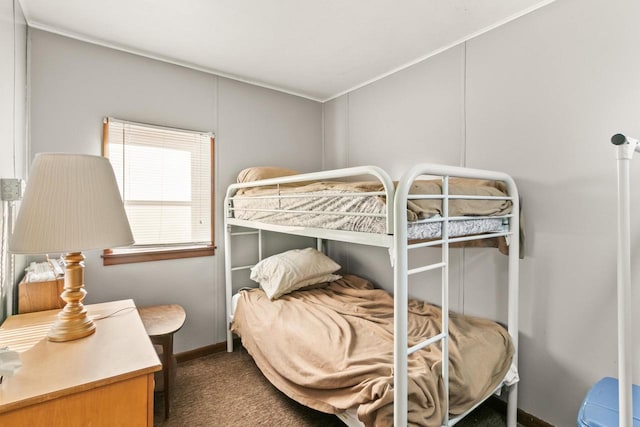 bedroom featuring carpet flooring and baseboards