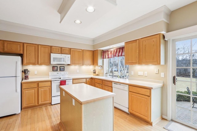 kitchen featuring a sink, light wood-type flooring, white appliances, and light countertops