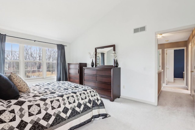 bedroom with visible vents, light carpet, baseboards, and vaulted ceiling