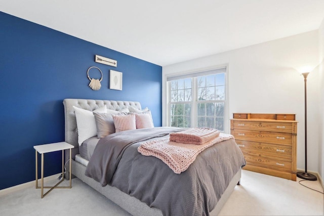 bedroom with carpet flooring and baseboards