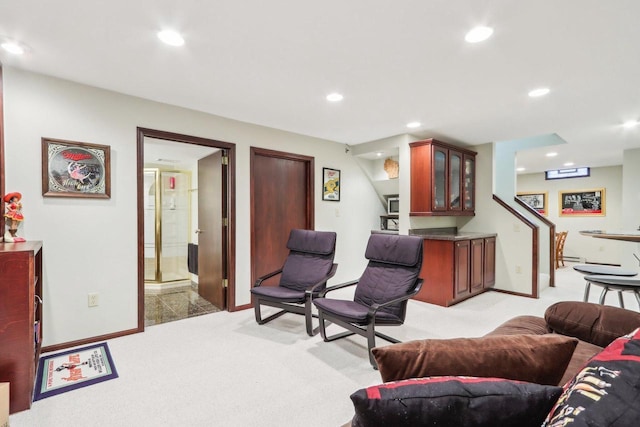 living area with recessed lighting, baseboards, and light carpet