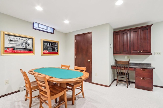 playroom featuring recessed lighting, built in desk, light colored carpet, and baseboards