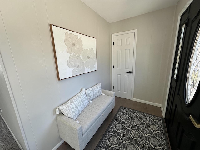 entryway with wood finished floors and baseboards