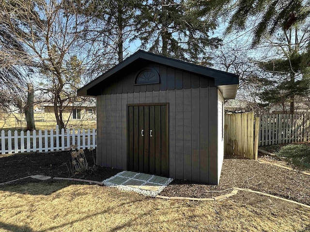 view of shed with fence