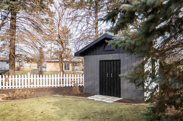 view of shed with fence