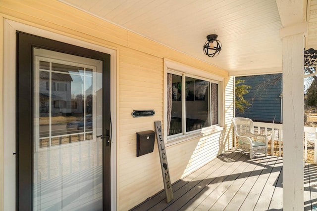 wooden deck featuring covered porch