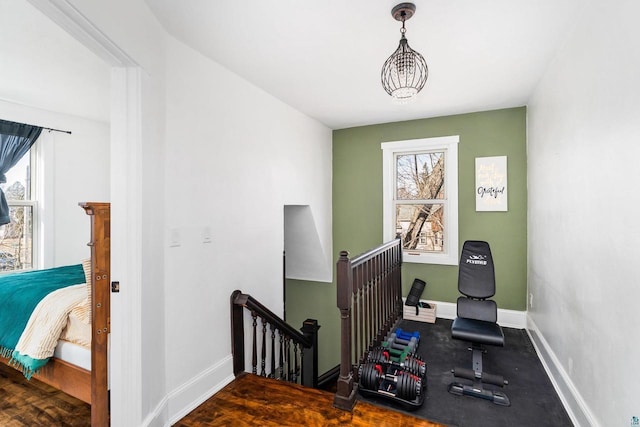 exercise room featuring baseboards