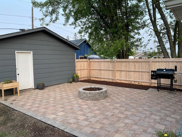 view of patio / terrace featuring grilling area, an outdoor fire pit, and fence