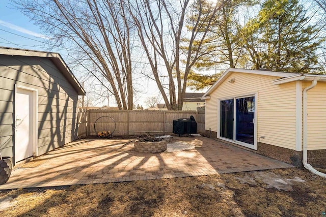 view of yard with a patio area, an outdoor fire pit, and fence