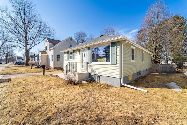 view of front of home featuring fence