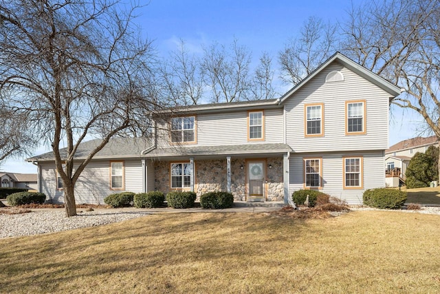 view of front facade featuring stone siding, a porch, and a front yard