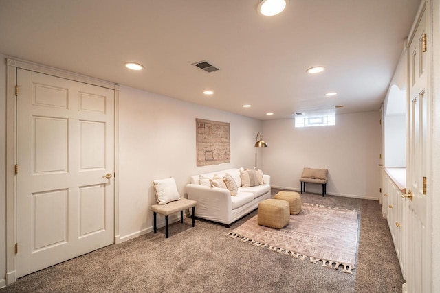 carpeted living area featuring recessed lighting, visible vents, and baseboards