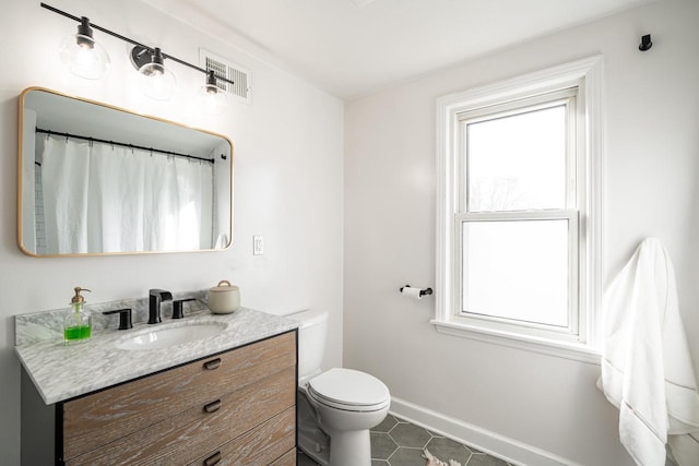 full bath featuring visible vents, baseboards, toilet, tile patterned floors, and vanity