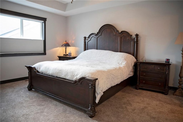 carpeted bedroom with baseboards