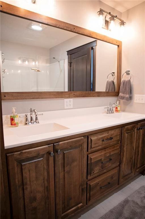 full bath with double vanity and a sink