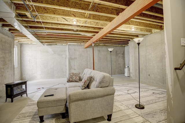 unfinished basement with a wood stove