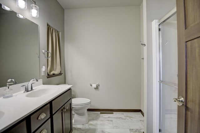 bathroom featuring visible vents, toilet, marble finish floor, a sink, and baseboards