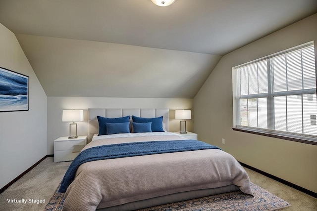 bedroom with light carpet, baseboards, and vaulted ceiling