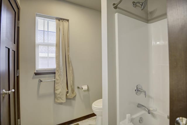 full bathroom with toilet, shower / tub combination, and baseboards