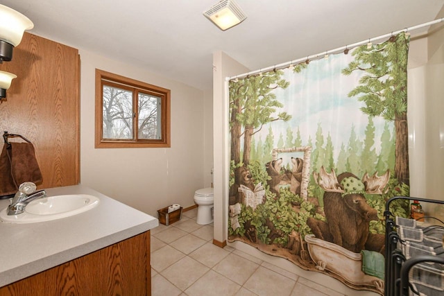 bathroom featuring vanity, a shower with shower curtain, visible vents, tile patterned floors, and toilet