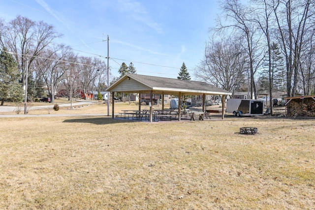 exterior space with a gazebo and a lawn