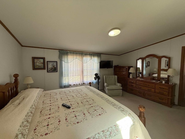 carpeted bedroom with ornamental molding