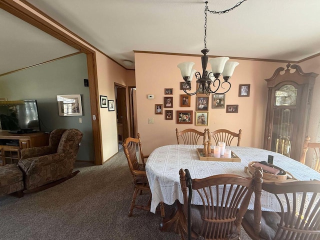 dining room featuring a chandelier, carpet flooring, and crown molding