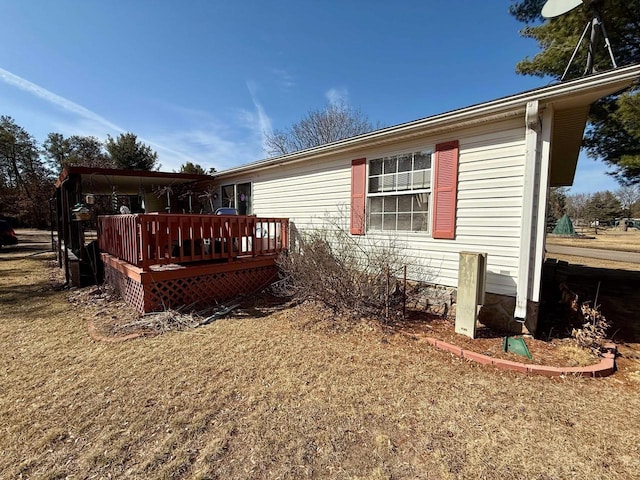 back of house featuring a deck