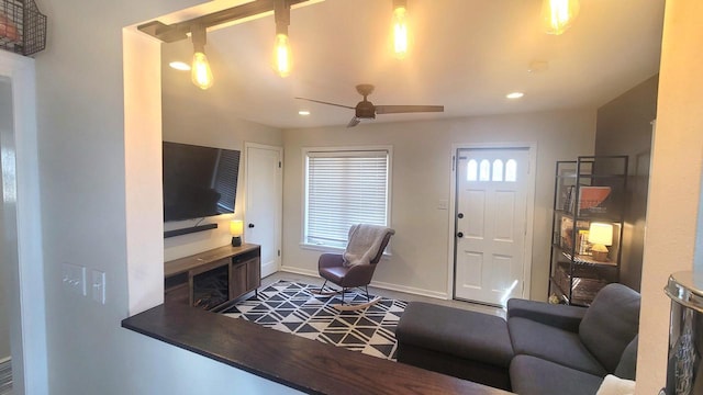 living room with recessed lighting, baseboards, and ceiling fan