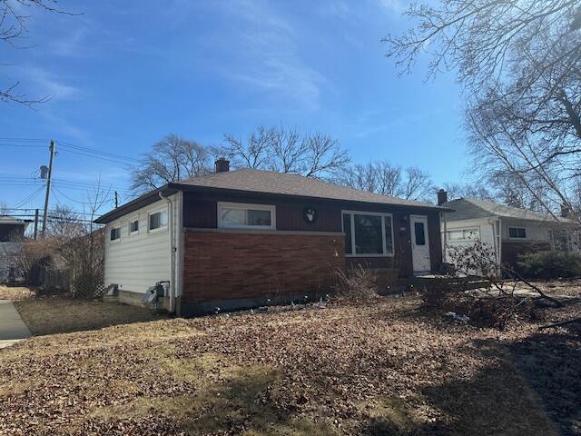 single story home with a chimney