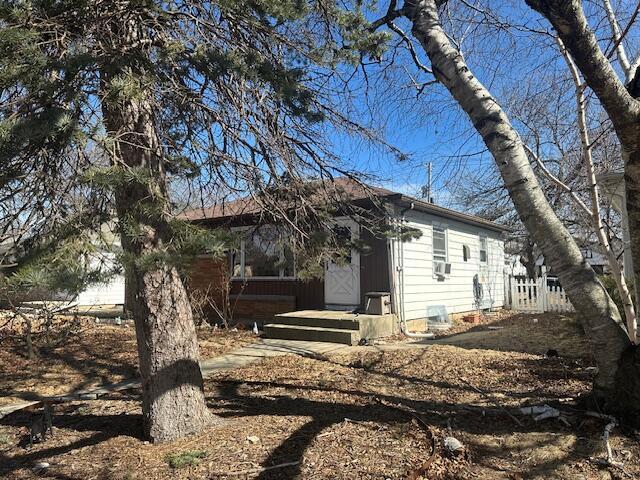 rear view of property with fence