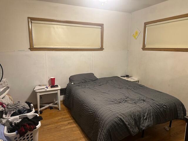 bedroom with wood finished floors