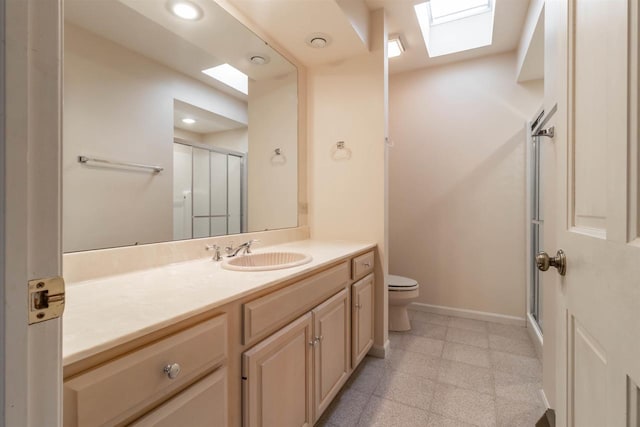 full bath with vanity, baseboards, recessed lighting, a stall shower, and toilet