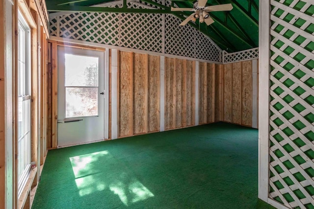 unfurnished room featuring lofted ceiling and ceiling fan