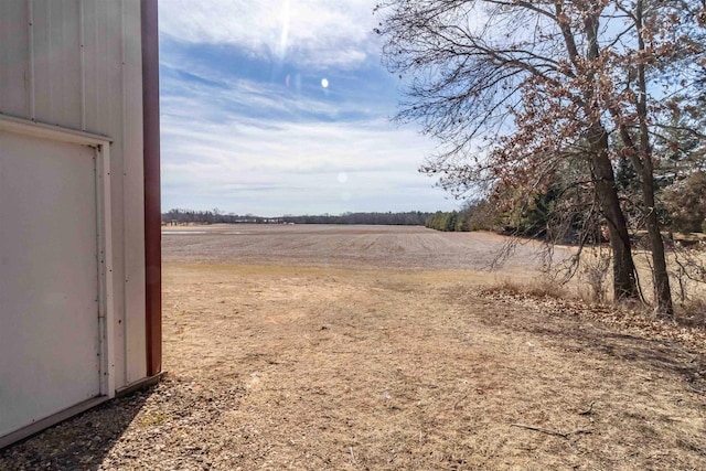 view of yard with a rural view