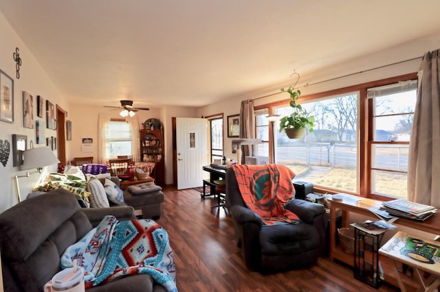 living area featuring dark wood finished floors and ceiling fan