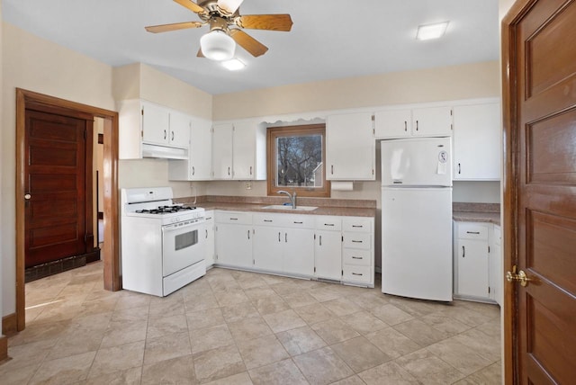 kitchen featuring white appliances, a ceiling fan, a sink, white cabinets, and under cabinet range hood