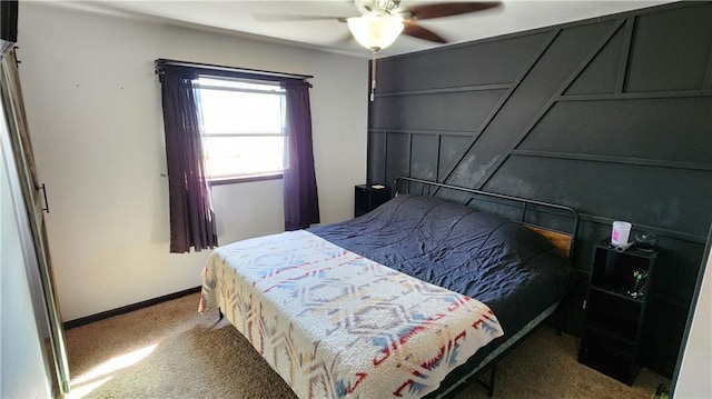 bedroom with baseboards, carpet, and a ceiling fan