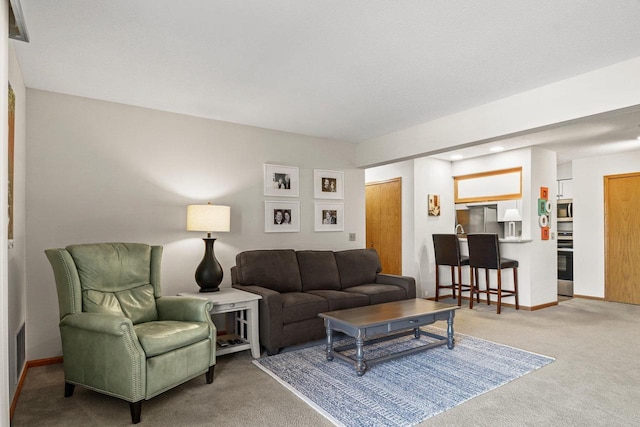 living area with carpet flooring and baseboards