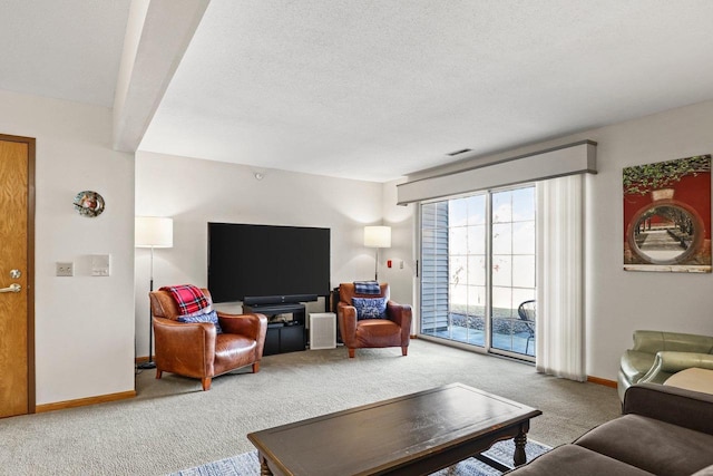 carpeted living area with visible vents, baseboards, and a textured ceiling