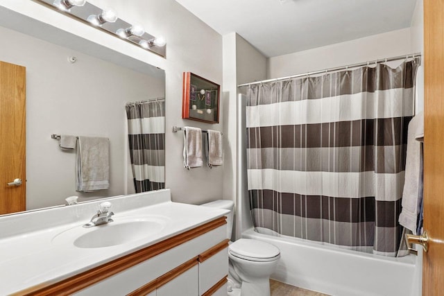 bathroom with vanity, toilet, and shower / bathtub combination with curtain