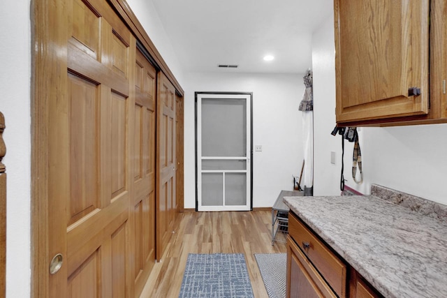 interior space with recessed lighting, visible vents, baseboards, and light wood-style floors