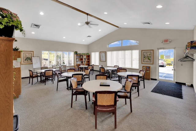 dining area with light colored carpet, visible vents, and a wealth of natural light