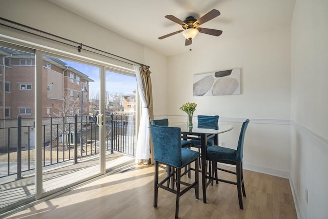 dining area with wood finished floors and baseboards