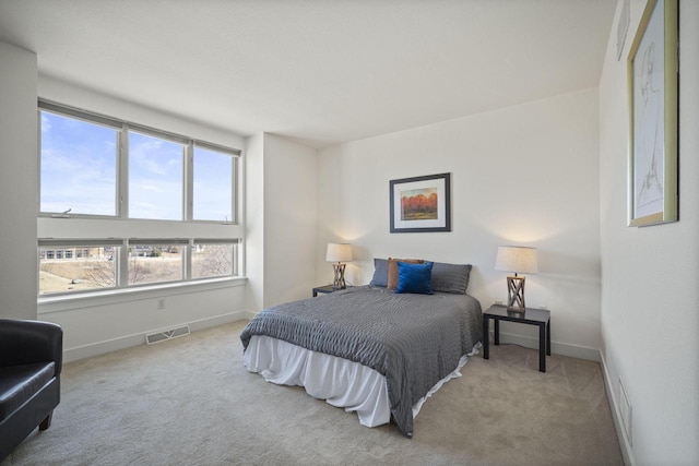 bedroom with visible vents, baseboards, and carpet floors