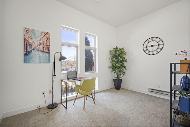 office area with baseboard heating, baseboards, and carpet