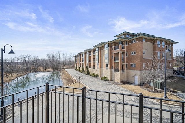 view of home's community with a water view